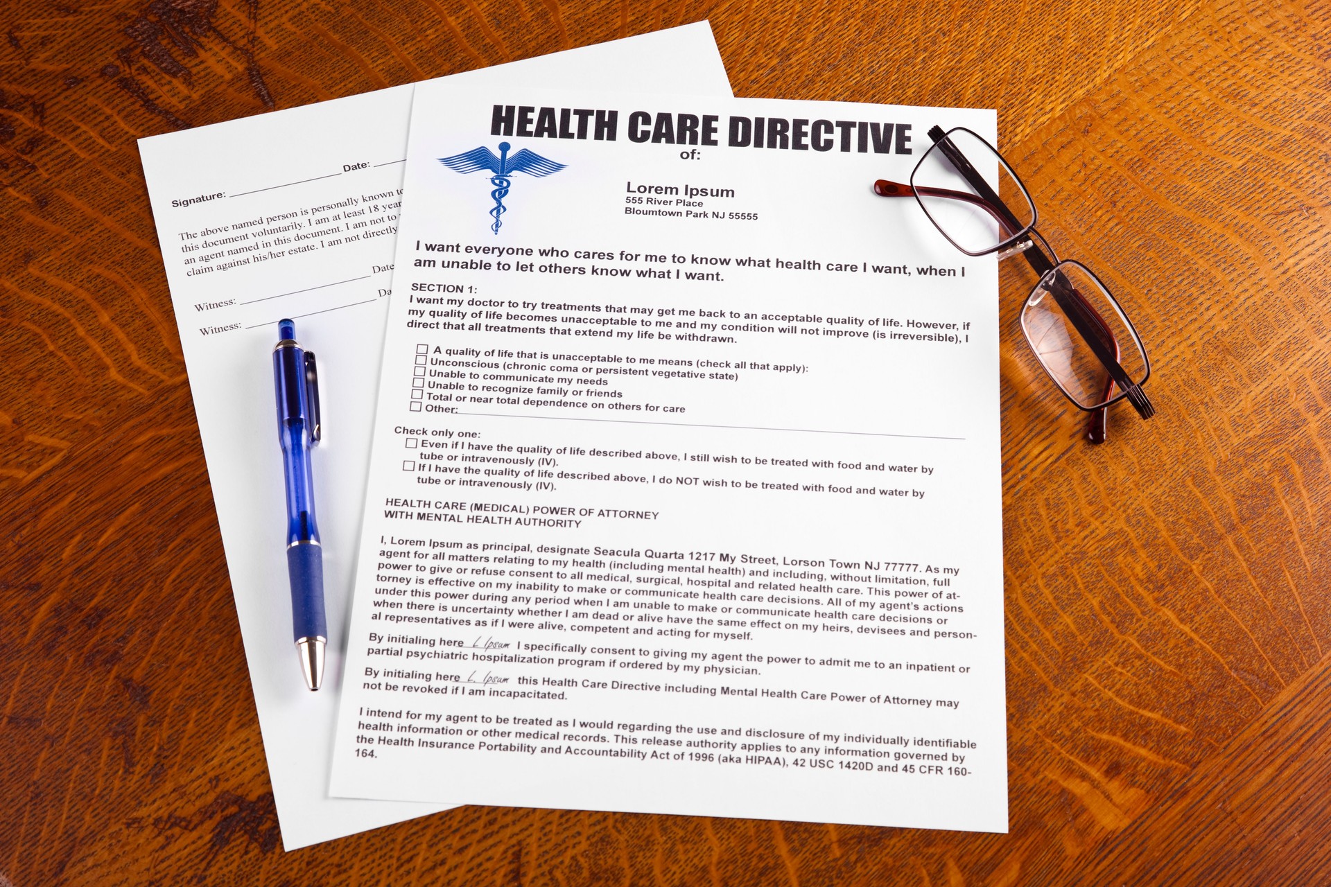 Health Care Directive or Living Will with pen and glasses